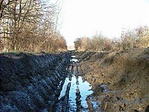 Nyomvályúban.